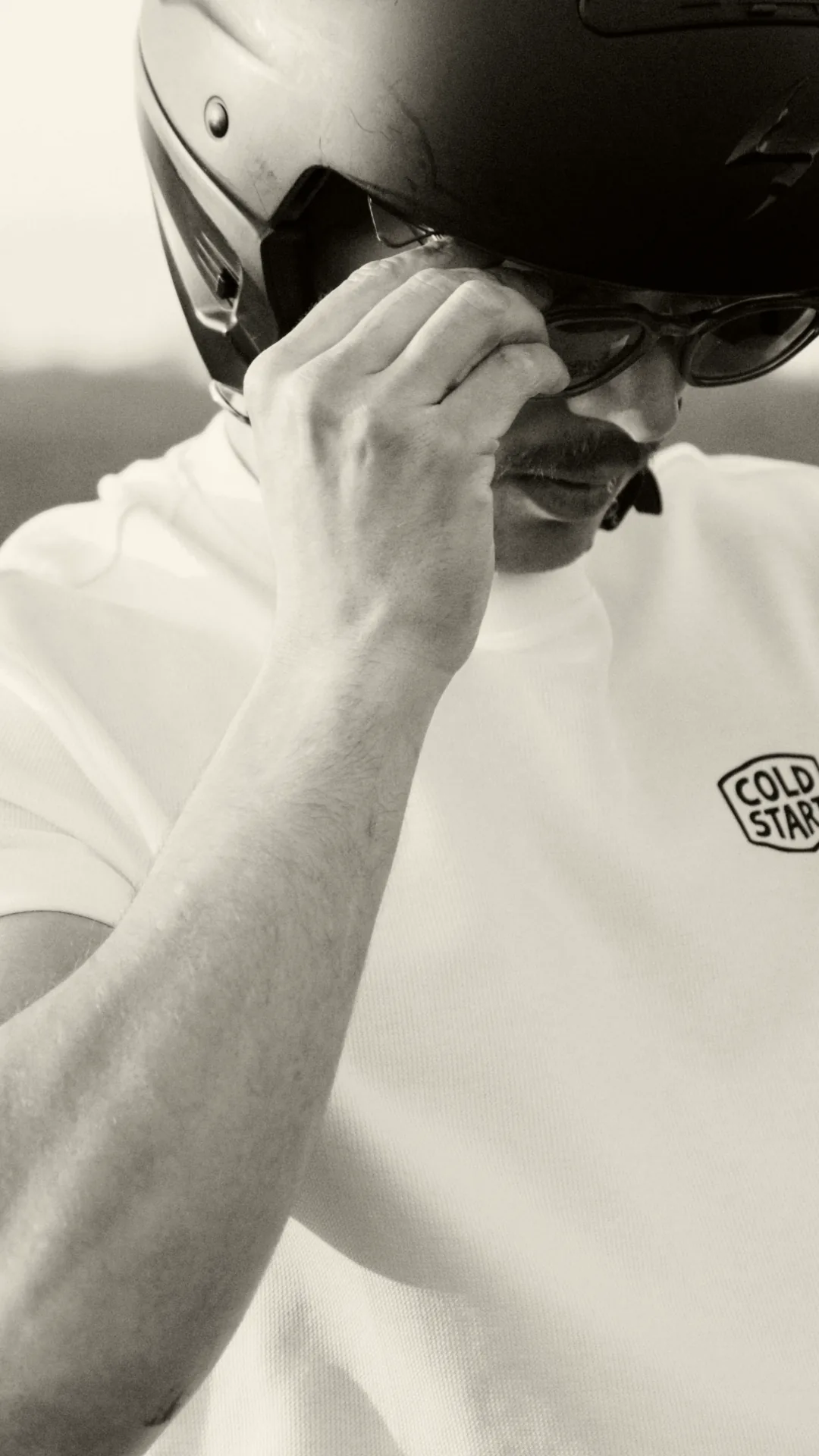 Portrait with helmet, sunglasses, and Cold Start shirt