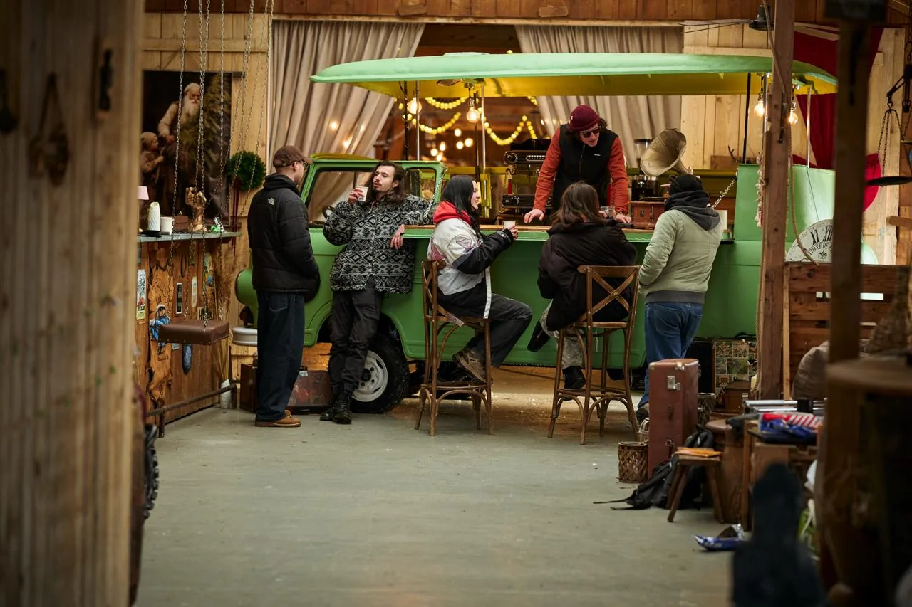 Group gathered at the green van bar in the barn