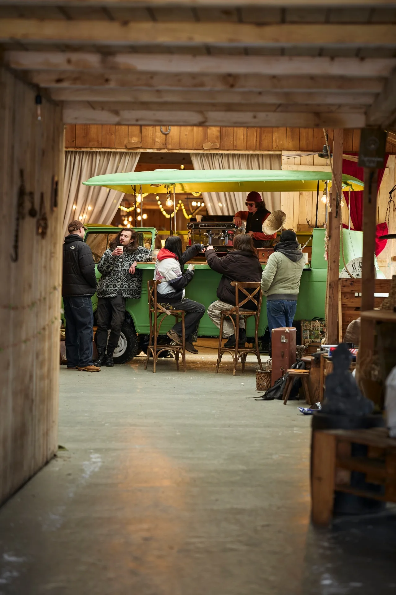 Customers gathered at the green van coffee bar